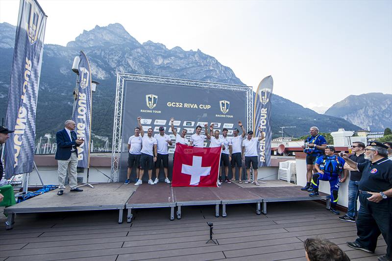 Alinghi receive their GC32 Riva Cup winner's trophy photo copyright Sailing Energy / GC32 Racing Tour taken at  and featuring the GC32 class