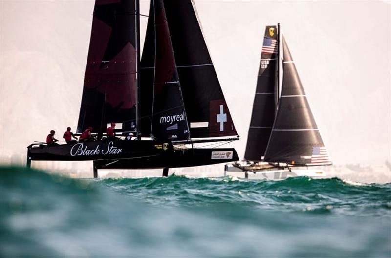 Christian Zuerrer's Black Star Sailing Team jockey with Jason Carroll's Argo - 2019 GC32 Oman Cup day 2 photo copyright Sailing Energy / GC32 Racing Tour taken at  and featuring the GC32 class