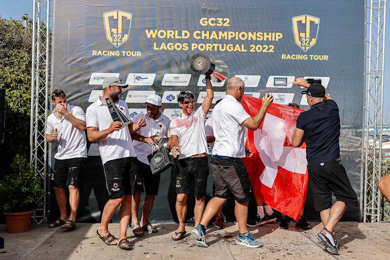 A jubliant Black Star Sailing Team crew at this evening's prizegiving in the Lagos GC32 Worlds photo copyright Sailing Energy / GC32 Racing Tour taken at Clube de Vela de Lagos and featuring the GC32 class