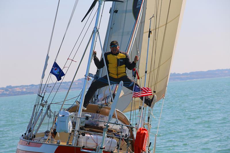 Istvan Kopar umping for joy as Puffin crosses the finish line - 2019 Golden Globe Race photo copyright Jane Zhou / GGR / PPL taken at  and featuring the Golden Globe Race class