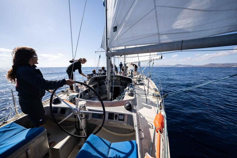 Pen Duick VI, fresh out of refit, is looking magnificent. Marie Tabarly enjoying at her helm. She is now in the Canary Islands after a 1200-mile passage and splashing on December 14 photo copyright Martin Keruzoré taken at  and featuring the Golden Globe Race class