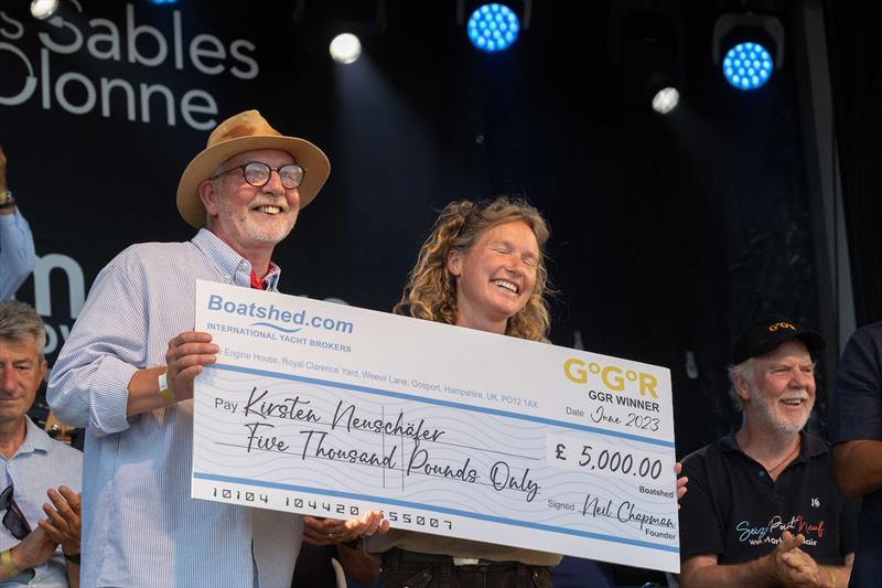 South African yachtswoman Kirsten Neuschäfer, winner of the 2022/3 Golden Globe Race, presented with her £5,000 winners cheque by Neil Chapman, CEO of Boatshed.com - photo © Tim Bishop / GGR / PPL