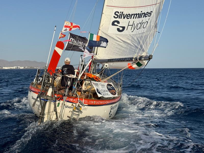 Seven hours behind the leader, and determined to keep chasing. Pat Lawless sails Saltram Saga 36 SILVERMINES HYDRO off Lanzarote during film-drop rendezvous. His early escape from Bay of Biscay has put him firmly among front-runners as fleet heads south - photo © Don McIntyre / GGR2026