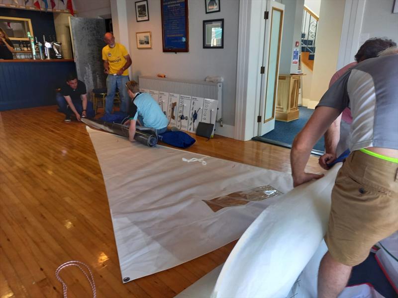 Progressive Credit Union GP14 Worlds 2022: Jon Close measuring a few sails photo copyright Andy Johnston taken at Skerries Sailing Club and featuring the GP14 class