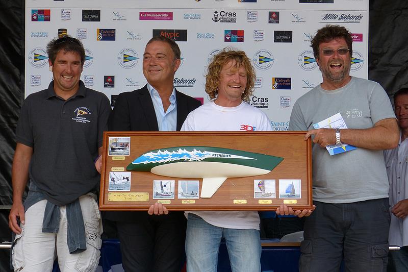 Francis Marshall (r) and his crew celebrate winning the Half Ton Spirit Trophy during the Half Ton Classics Cup at Sport Nautique Saint-Quay-Portrieux photo copyright Fiona Brown / www.fionabrown.com taken at Sport Nautique de Saint-Quay-Portrieux and featuring the Half Tonner class