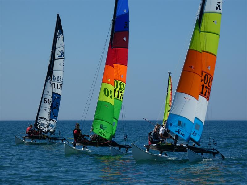 RCIYC Hobie Fleet - Love Wine 'Summer Breeze' series photo copyright Elaine Burgis taken at Royal Channel Islands Yacht Club and featuring the Hobie 16 class