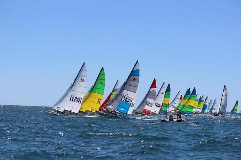 Colourful and spectacular racing photo copyright Kathy Miles taken at Esperance Bay Yacht Club and featuring the Hobie 16 class