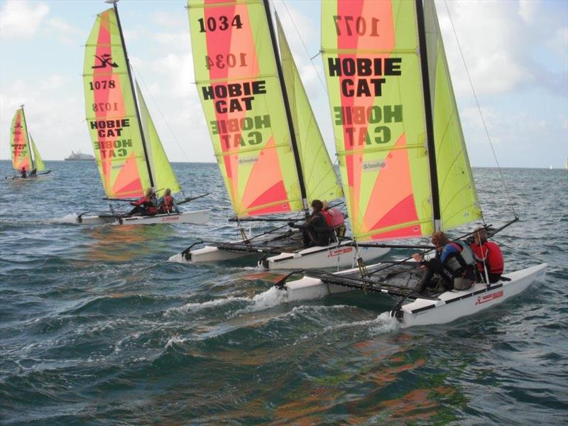 Junior Hobie Dragoons at the Stonehage Channel Islands Hobie Cat Championships 2014 photo copyright Elaine Burgis taken at Royal Channel Islands Yacht Club and featuring the Hobie Dragoon class