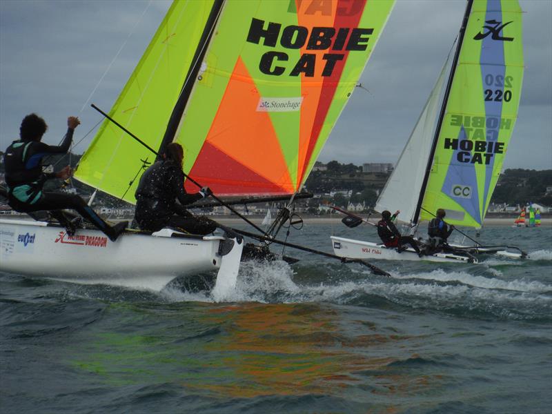 Hobie Dragoon Class winners, Elsa Swetenham and Finlay Arenz in the foreground during the Rubicon (Jersey) Channel Islands Hobie Cat Championships photo copyright Bill Harris taken at Royal Channel Islands Yacht Club and featuring the Hobie Dragoon class