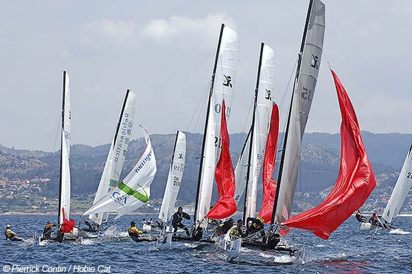 The fleet round the leeward mark on the final day of the Hobie Tiger Worlds 2006 at Cangas, Spain photo copyright Pierrick Contin taken at  and featuring the Hobie Tiger class