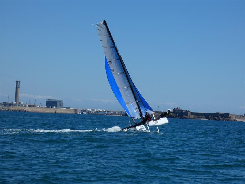 Darren Stower and Julian Adamson's Hobie Wildcat during the Love Wine 'Summer Breeze' Series in Jersey photo copyright Elaine Burgis taken at Royal Channel Islands Yacht Club and featuring the Hobie Wild Cat class