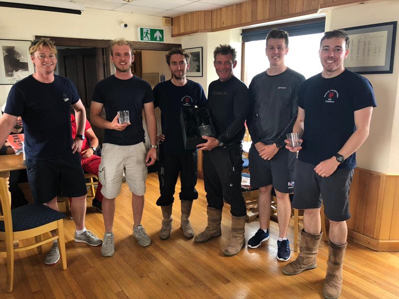 Chris Spark and the winning crew of Turbulence with SYC Fleet captain Rudi Barman during the 707 Northerns at Scarborough prize giving photo copyright Chris Clark taken at Scarborough Yacht Club and featuring the 707 class