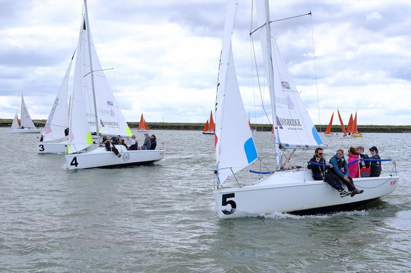 Hunter 707 fleet action on the opening day of Burnham Week 2021 photo copyright Roger Mant taken at Royal Burnham Yacht Club and featuring the 707 class