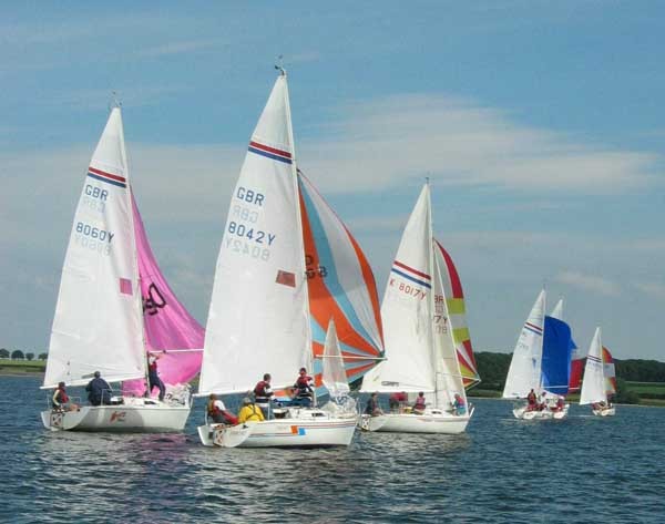 The fleet sails downwind at the 2003 Hunter Formula One Nationals  photo copyright Mark Feagan taken at Rutland Sailing Club and featuring the Hunter Formula One class