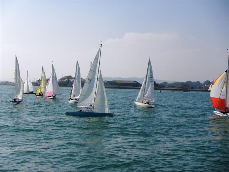 Race 1 finish during the Bembridge Illusion Picnic Hamper and Invitational photo copyright Mike Samuelson taken at Bembridge Sailing Club and featuring the Illusion class