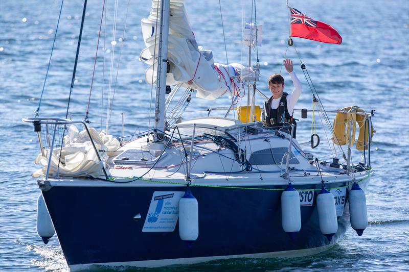 Timothy Long at the helm of his 28ft boat, Alchemy, which he sailed round Britain to become the youngest person to achieve that feat photo copyright Marc Turner / PFM Pictures taken at  and featuring the Impala 28 class