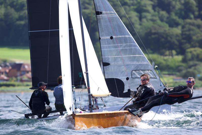 Classic crossing a modern 14 during the Classic & Vintage International 14 POW Cup Race 2026 photo copyright Patrick Condy taken at Largs Sailing Club and featuring the International 14 class