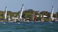 The  US International Moth Championships fleet screams downwind toward the beach in one of half a dozen impromptu races after official racing was cancelled on Sunday in front of the Upper Keys Sailing Club © Meredith Block / US Moth Class