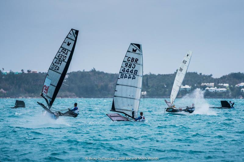 Aymeric Arthaud (left) of France, Michael Barnes of the U.K. and Australian Ted Hackney navigate through a minefield of capsized boats on day 2 of the Bacardi Moth Worlds in Bermuda photo copyright Beau Outteridge / www.beauoutteridge.com taken at Royal Bermuda Yacht Club and featuring the International Moth class