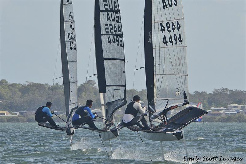 Matthew Chew being chased down by Reese Tailby and Josh McKnight photo copyright Emily Scott Images taken at Royal Queensland Yacht Squadron and featuring the International Moth class
