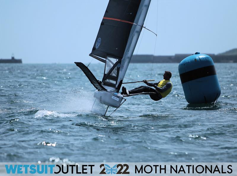 Simon Hiscocks finishes Race 16, looking to see who had won the race, on Day 4 of the 2022 Wetsuit Outlet UK Moth Class Nationals at the WPNSA photo copyright Mark Jardine / IMCA UK taken at Weymouth & Portland Sailing Academy and featuring the International Moth class