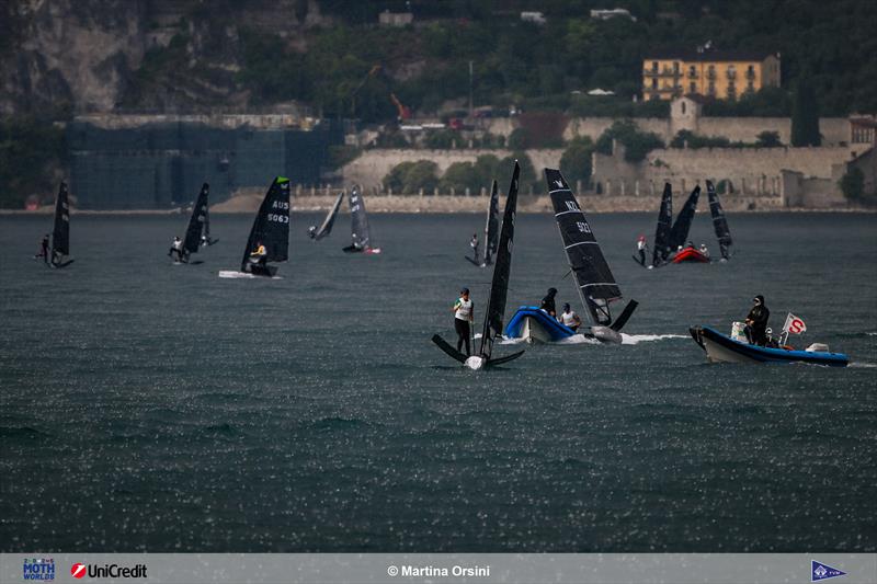 The storm comes in on 2025 International Moth Worlds at Fraglia Vela Malcesine Day 1 photo copyright Martina Orsini taken at Fraglia Vela Malcesine and featuring the International Moth class