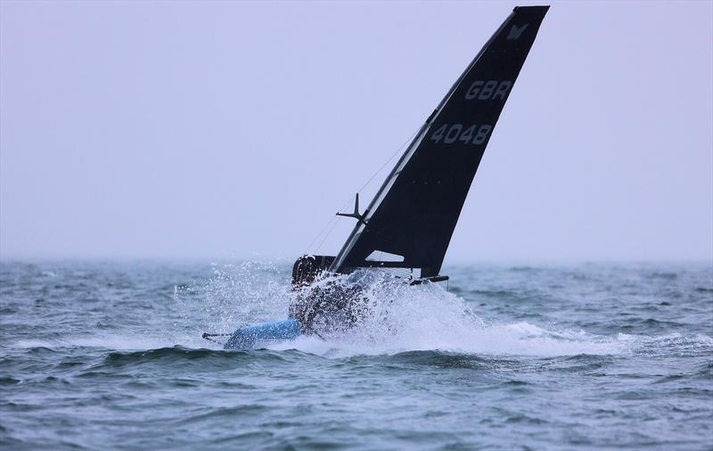 GBR 4048 Jonathan Peats in a sea of spray during Race 9 on Wetsuit Outlet International Moth UK Championship Day 4 photo copyright Mark Jardine taken at Royal Torbay Yacht Club and featuring the International Moth class