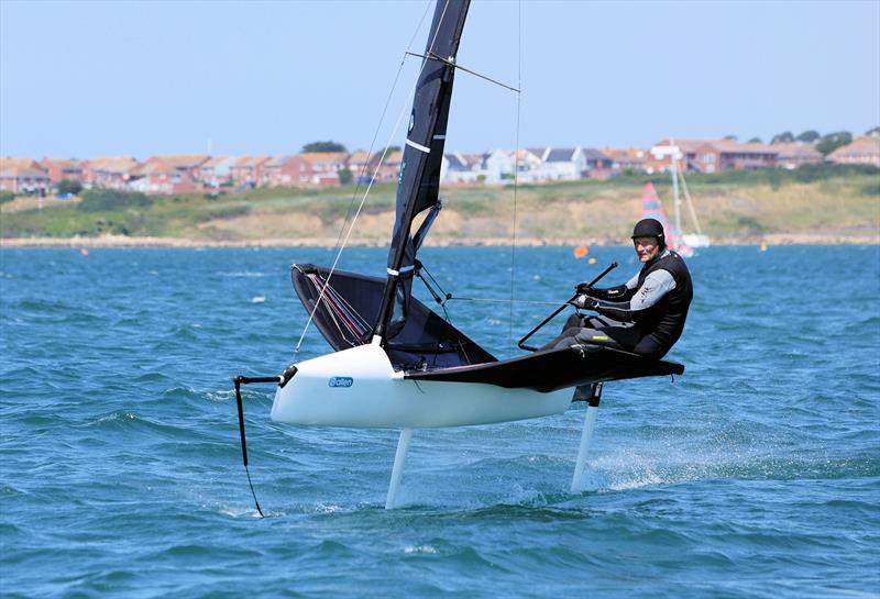 Wetsuit Outlet International Moth UK Nationals at the WPNSA Day 4 - GBR 4817 Philip Rees finishes Race 9 photo copyright Mark Jardine taken at Weymouth & Portland National Sailing Academy and featuring the International Moth class