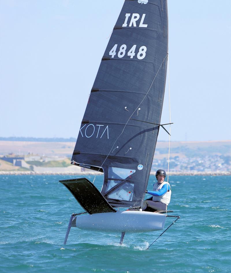 Wetsuit Outlet International Moth UK Nationals at the WPNSA Day 4 - IRL 4848 Ronan Wallace finishes Race 9 photo copyright Mark Jardine taken at Weymouth & Portland National Sailing Academy and featuring the International Moth class