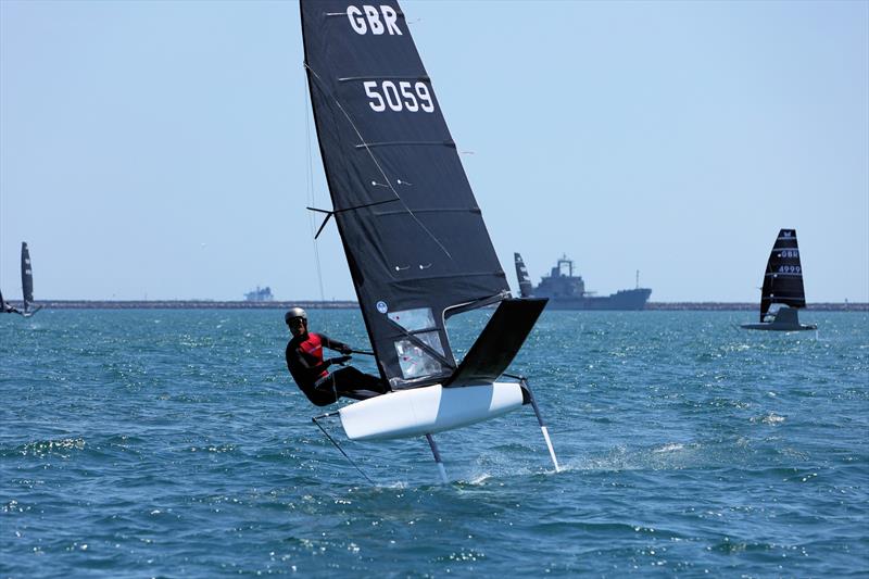 Wetsuit Outlet International Moth UK Nationals at the WPNSA Day 4 - GBR 5059 Alex Hughes at the Race 12 leeward gate photo copyright Mark Jardine taken at Weymouth & Portland National Sailing Academy and featuring the International Moth class