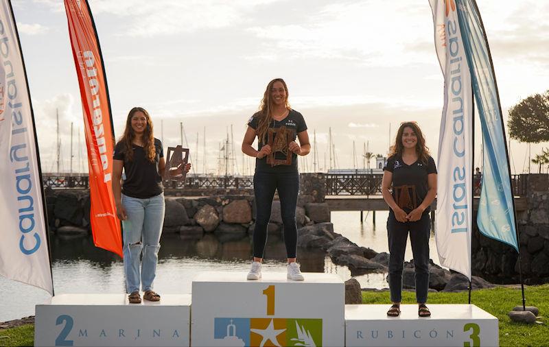 iQFoil Women's Podium: Tibi flanked by her teammates Kantor (left) and Morris (right) at the Lanzarote International Regatta photo copyright Sailing Energy taken at Lanzarote Sailing Center and featuring the iQFoil class