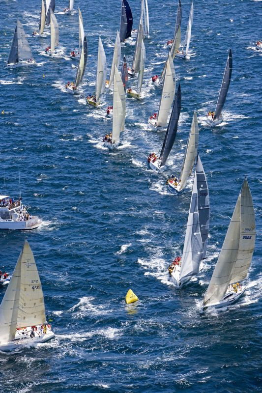 The fleet round the first mark after the Rolex Sydney Hobart Yacht Race 2006 photo copyright Daniel Forster / Rolex taken at  and featuring the IRC class
