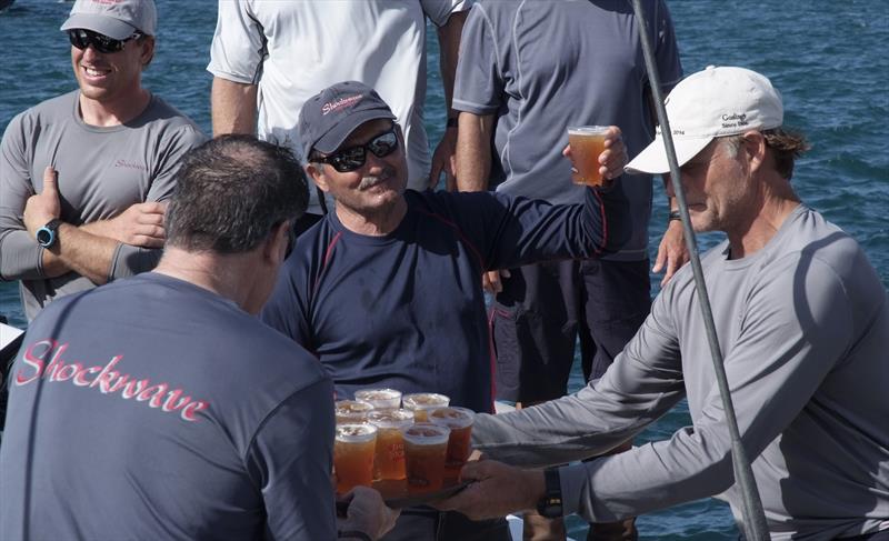 George Sakellaris, owner of the first to finish yacht Shockwave celebrates with Gosling's Dark 'n Stormy drink with his crew on arrival at the Royal Bermuda YC dock after the Newport Bermuda Race - photo © Barry Pickthall / PPL