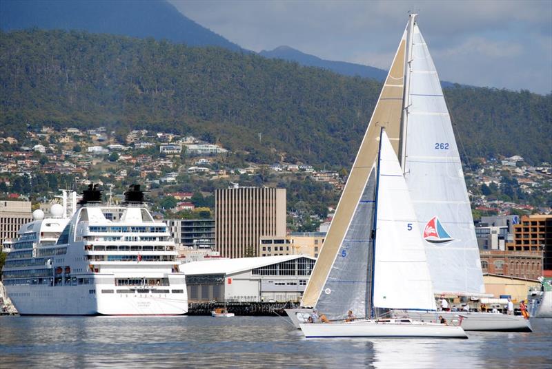 AMS winner of the Bruny Island Race,  Michael Hutchinson's Hobie 33 Emotional Rescue, paces it with Rob Fisher and Paul Mara's Helsal 3 after Saturday morning start of the 90th Bruny Island Race photo copyright Peter Campbell taken at Royal Yacht Club of Tasmania and featuring the IRC class