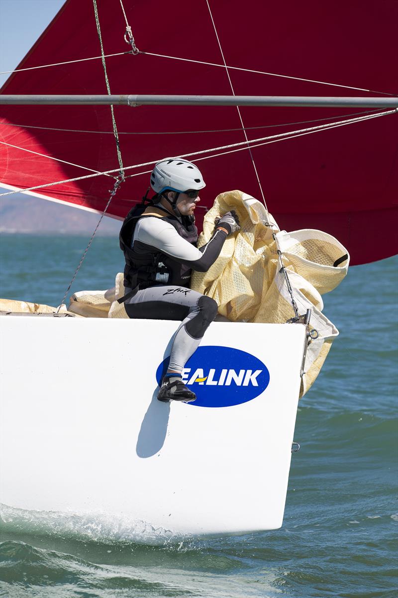 Kite up and headsail down on Guilty Pleasures VII at SeaLink Magnetic Island Race Week photo copyright Andrea Francolini taken at Townsville Yacht Club and featuring the IRC class