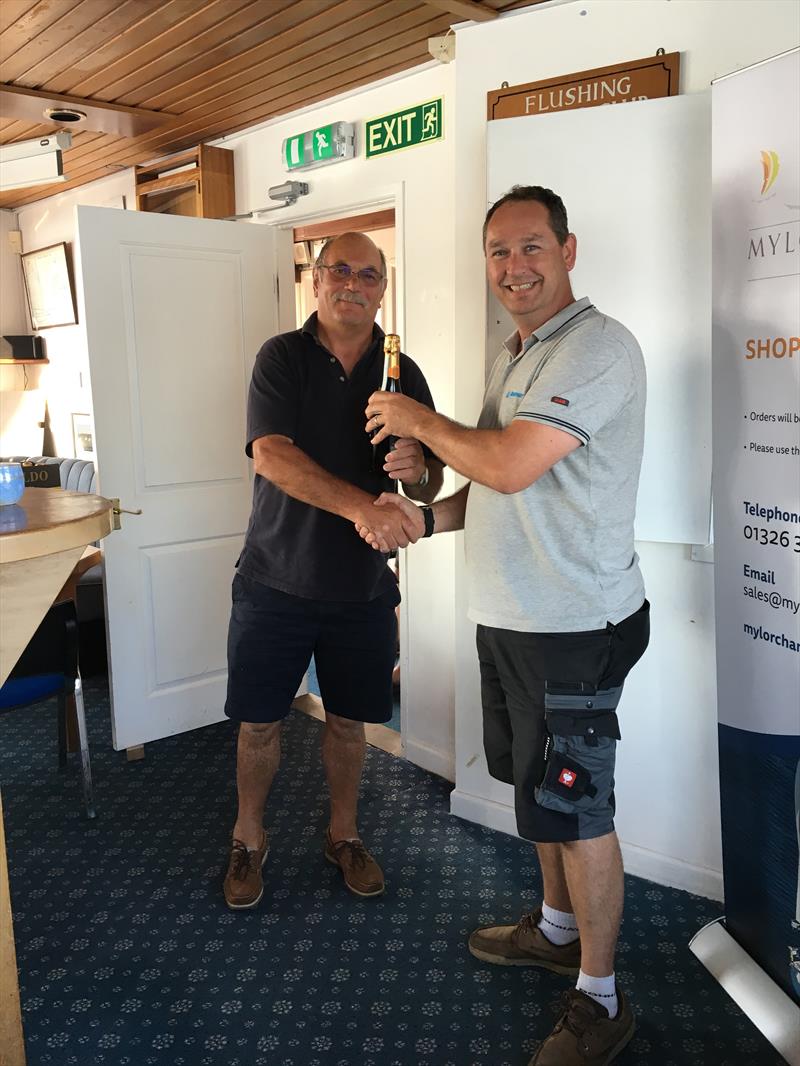 Chris Jelliss receiving his day prize from Paul Pullen, Managing Director of Mylor Chandlery & Rigging, on day 1 of the Ancasta IRC South West Championships photo copyright Mandy Owens taken at Flushing Sailing Club and featuring the IRC class