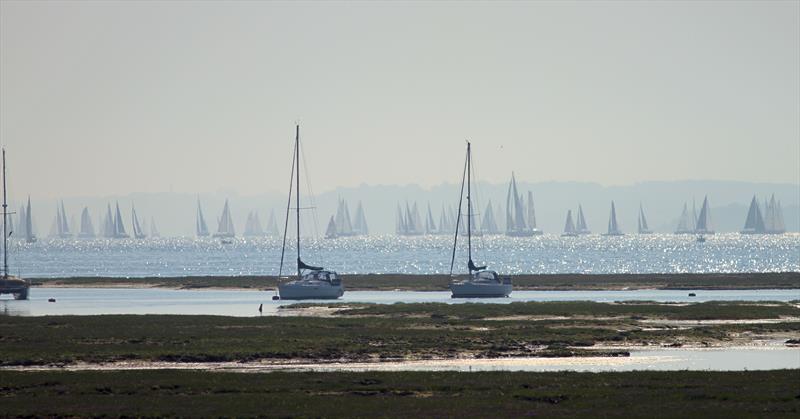 The leaders pass Hurst Castle and approach the Needles during the 2018 Round the Island Race photo copyright Mark Jardine / YachtsandYachting.com taken at  and featuring the IRC class