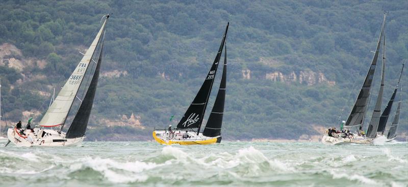 The 2019 Rolex Fastnet Race fleet pass Hurst Casle photo copyright Mark Jardine taken at Royal Ocean Racing Club and featuring the IRC class