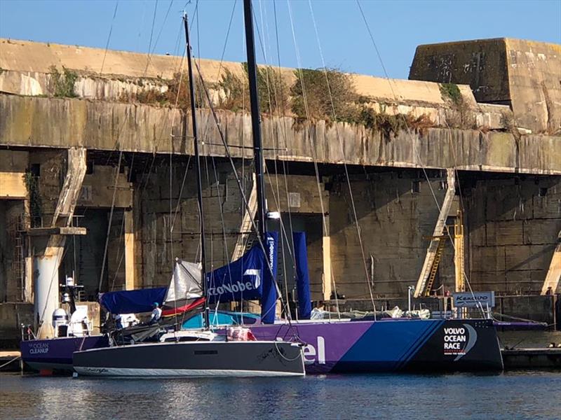 L30, a 30-foot one design keelboat, is dwarfed by a VO65 berthed in Lorient. - photo © L30class.org