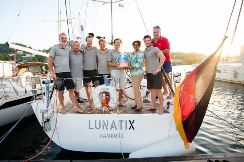 German XP-50 Lunatix is welcomed by the Grenada Tourism Authority with a basket of Grenadian produce - photo © RORC / Arthur Daniel