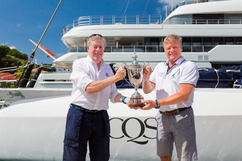 Ludde Ingvall's Australian Maxi CQS took line honours and was awarded the International Maxi Association (IMA) Transatlantic Trophy by Andrew McIrvine, IMA Secretary General photo copyright RORC / Arthur Daniel taken at Royal Ocean Racing Club and featuring the IRC class