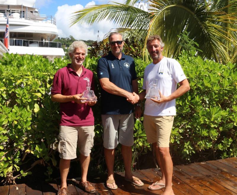 RORC Commodore, Steven Anderson presents Rupert Holmes (L) and Richard Palmer (R), owner of Jangada, JPK 10.10 with prizes for winning IRC Two and IRC Two Handed photo copyright RORC taken at Royal Ocean Racing Club and featuring the IRC class
