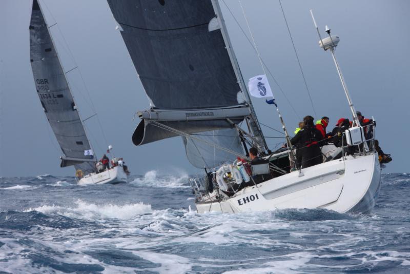 In IRC Two Andy Middleton's Beneteau First 47.7 EH01 is estimated to be just five minutes ahead on corrected time from Ossie Stewart and Ross Applebey's Dufour 45 Scarlet Island Girl – RORC Caribbean 600 photo copyright RORC / Tim Wright / www.photoaction.com taken at Royal Ocean Racing Club and featuring the IRC class