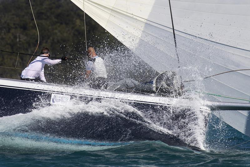 No problems about getting wet when you are in the tropics. On the bow of the R/P66, Alive. 2018 Airlie Beach Race Week photo copyright Andrea Francolini taken at Whitsunday Sailing Club and featuring the IRC class