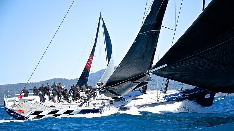 The supermaxi Black Jack sets up to leeward of Wild Oats XI - Hamilton Island Race Week - August photo copyright Richard Gladwell taken at Hamilton Island Yacht Club and featuring the IRC class
