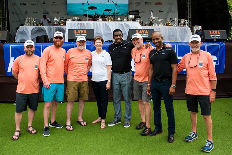 KPMG principals fraternizing with yacht crew during KPMG afternoon prize giving ceremony photo copyright Antigua Sailing Week taken at Antigua Yacht Club and featuring the IRC class