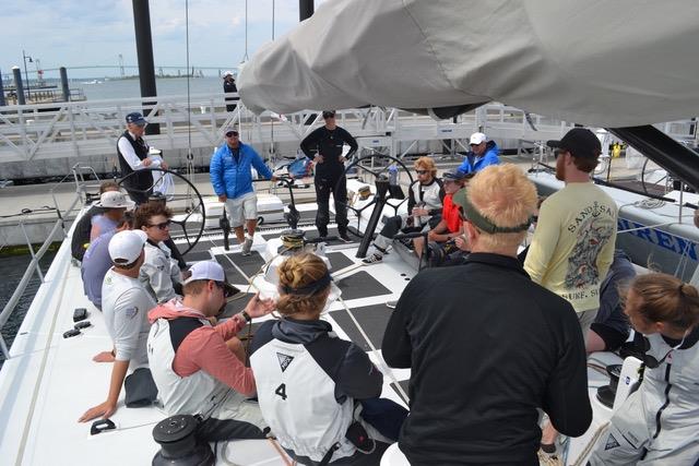 YASA coaches Peter Becker (starboard wheel), Ralfie Steitz (blue jacket) and Sara Hastreiter, (all black at port wheel) conduct a debriefing aboard RP 63 Gambler, prior to the Newport to Bermuda Race June 2018 - photo © Joe Cooper/YASA