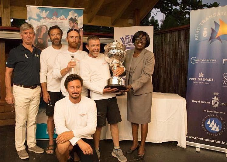 Grenadian Minister for Tourism & Civil Aviation, Dr. Clarice Modeste-Curwen, M.P. presents Franco Niggeler and some of his Cookson 50 Kuka3 crew with the magnificent RORC Transatlantic Race Trophy at the prize giving - photo © Arthur Daniel / RORC