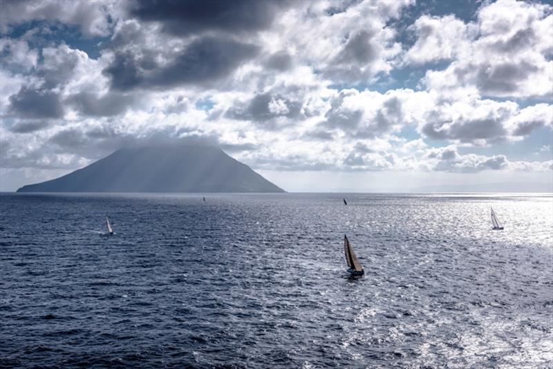 Fleet passing the active volcano of Stromboli - Rolex Middle Sea Race 2018 photo copyright Rolex / Kurt Arrig taken at Royal Malta Yacht Club and featuring the IRC class