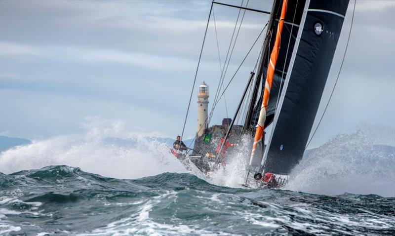 The 30.48 metre (100 foot) SHK Scallywag is dwarfed by steep seas as she rounds the Fastnet Rock - 2019 Rolex Fastnet Race photo copyright Rolex / Kurt Arrig taken at Royal Ocean Racing Club and featuring the IRC class